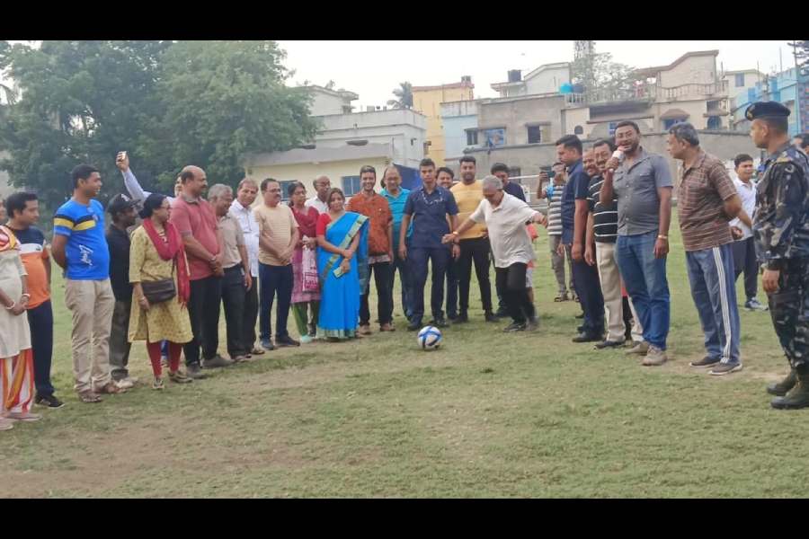 The BJP’s Dilip Ghosh prepares to show off his football skills while campaigning in Burdwan.