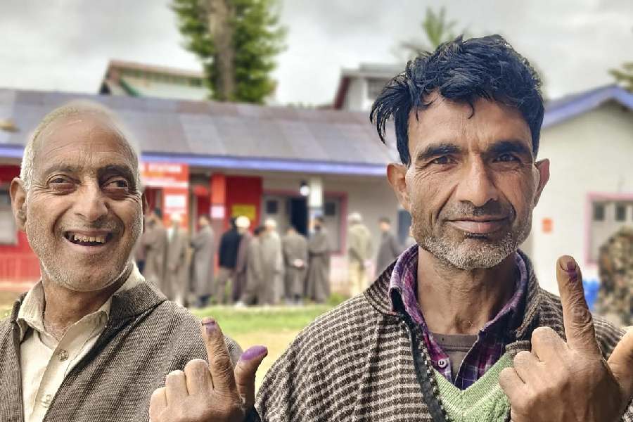 Rare Sight: Voters show their inked fingers at a polling booth in Srinagar on Monday.