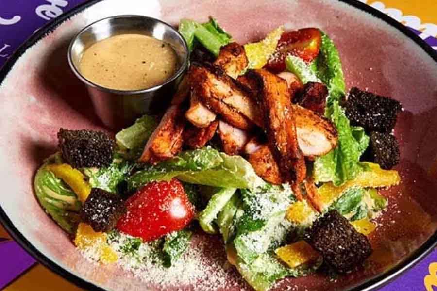 Enjoy the Cajun Chicken Caesar Salad Bowl at this restaurant
