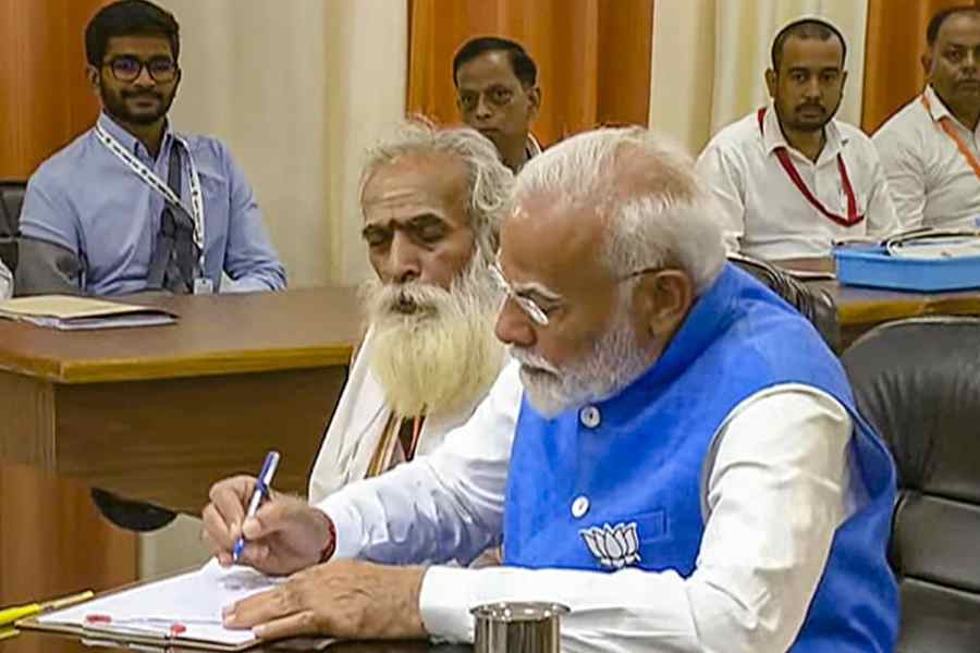 Narendra Modi, accompanied by Ganeshwar Shastri, files his nomination papers in Varanasi on Tuesday.