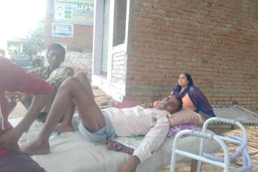 Osman Khan, a migrant worker who fractured his leg while pulling a trolley.