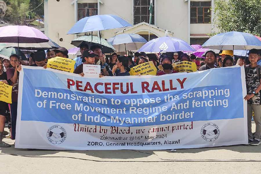 Activists carry a banner during a rally against scrapping of the Free Movement Regime (FMR), at Zokhawthar village along the India-Myanmar border, in Champhai district