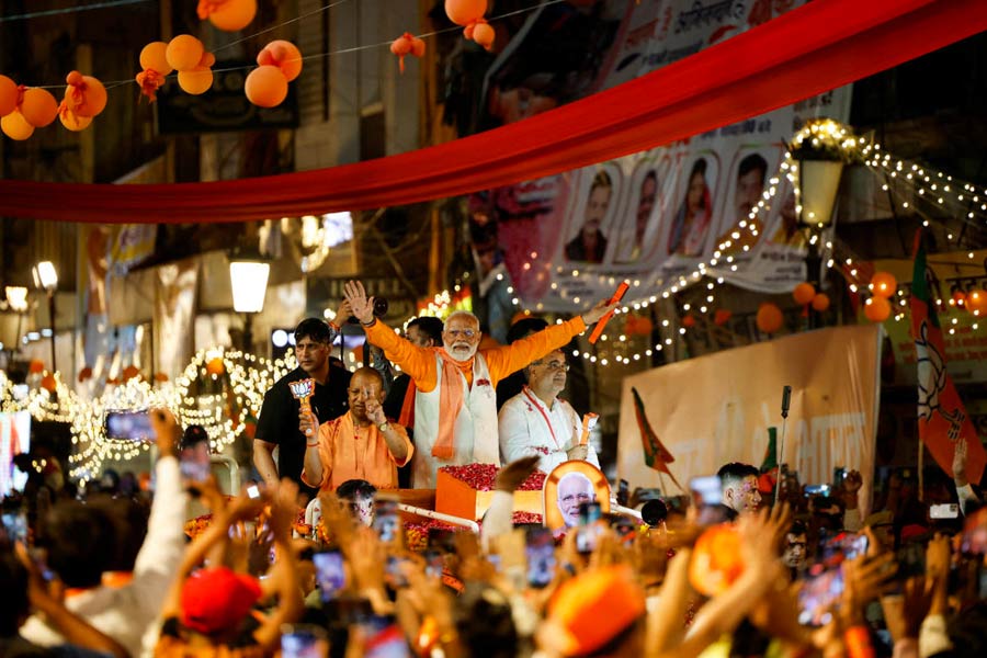 Prime Minister Narendra Modi and Chief Minister of Uttar Pradesh Yogi Adityanath attend a roadshow as part of an election campaign, in Varanasi, India, May 13, 2024.