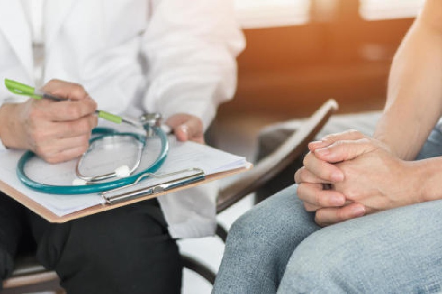 A psychiatrist examining a stressful woman patient