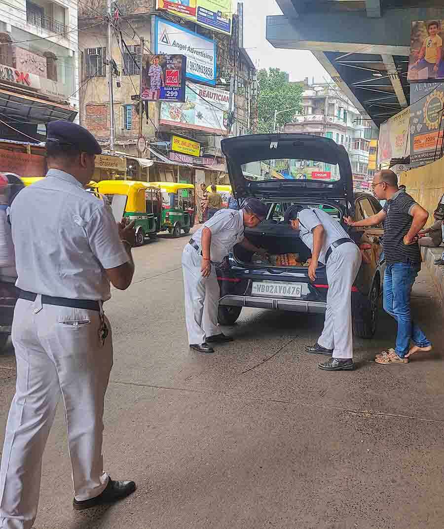 Kolkata police check a vehicle in Gariahat before the Lok Sabha elections in Kolkata. The city votes on June 1