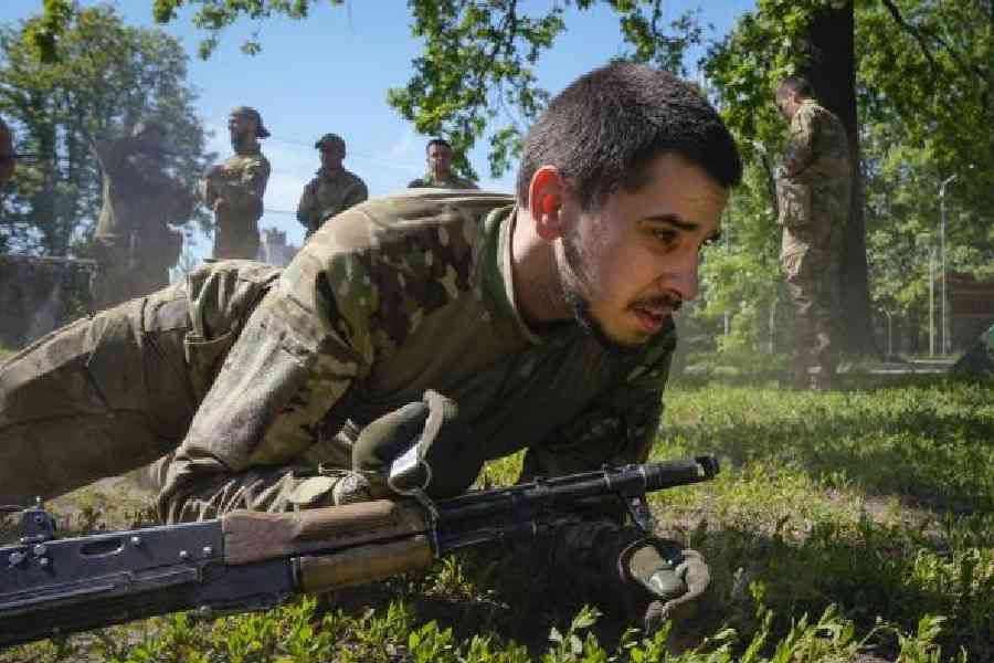 A newly recruited soldier of the 3rd assault brigade trains in Kyiv