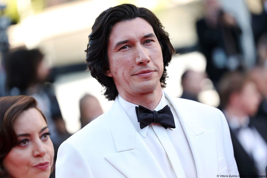 Adam Driver appeared at the world premiere of his film Megalopolis with filmmaker Francis Ford Coppola in a white suit and black bowtie.