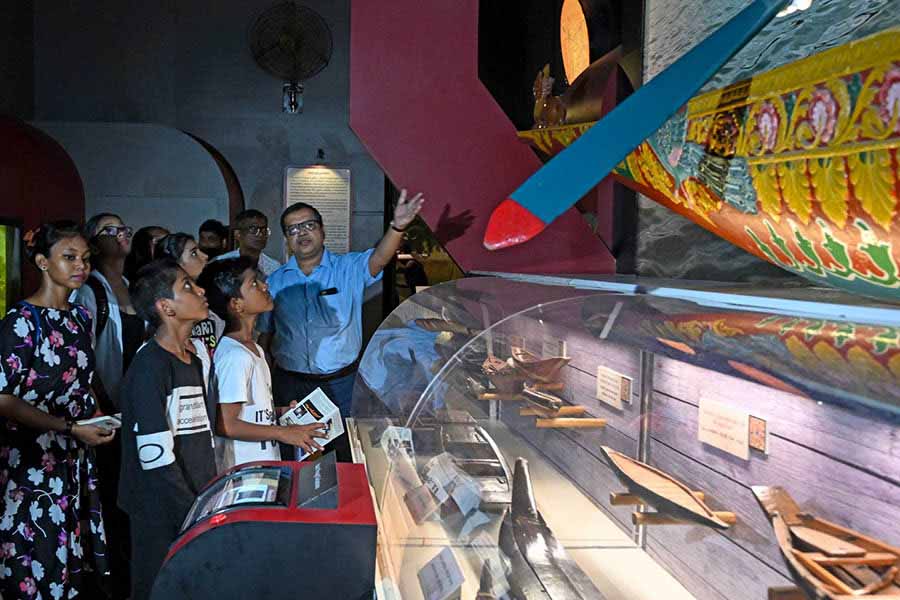 Subhabrata Chaudhuri, director, Birla Industrial and Technological Museum, explains students the evolution of boats on Saturday.