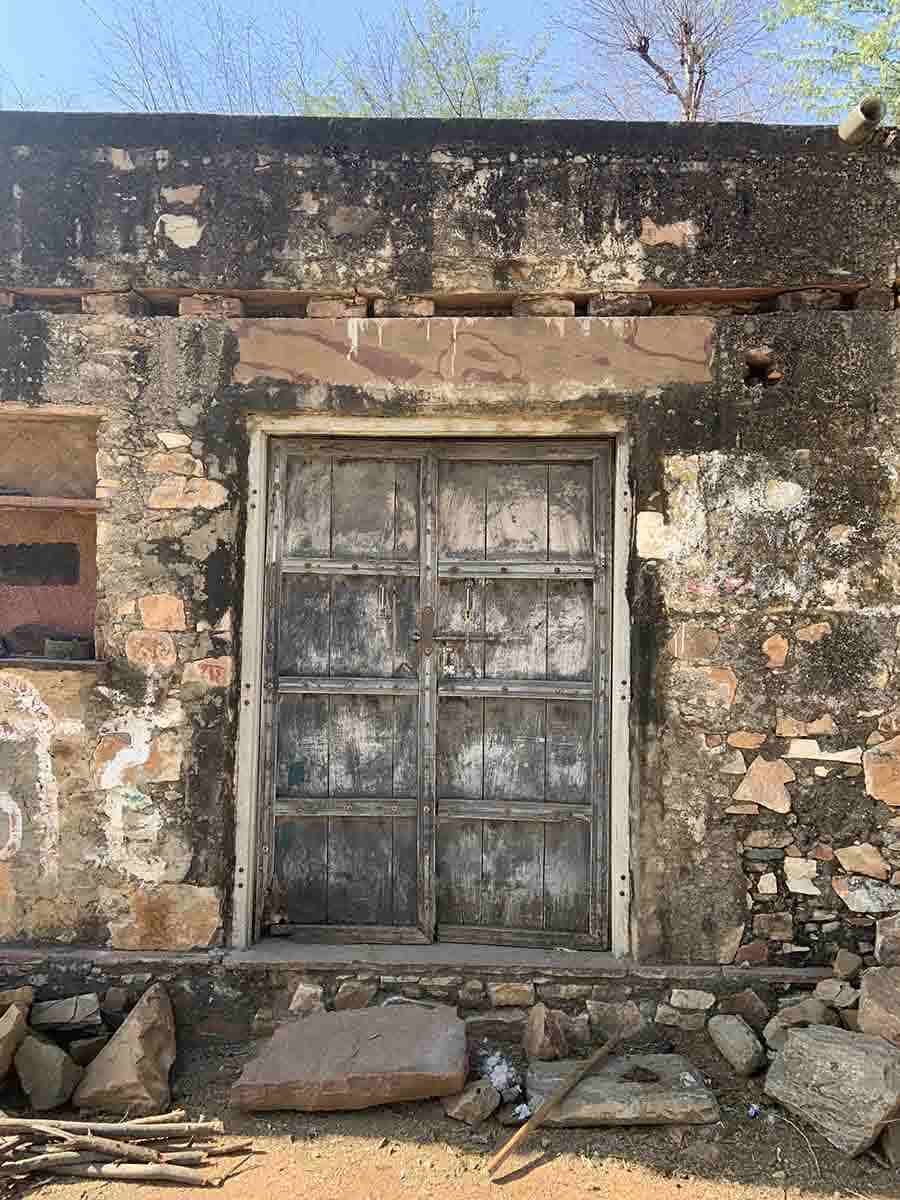 The door of an abandoned building in the village