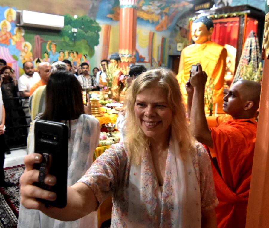 It’s time for a quick selfie for this devotee at the College Square temple on Thursday