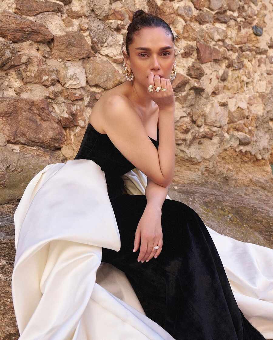 The gown featured a pair of floor-sweeping white trains stitched to its waistline.