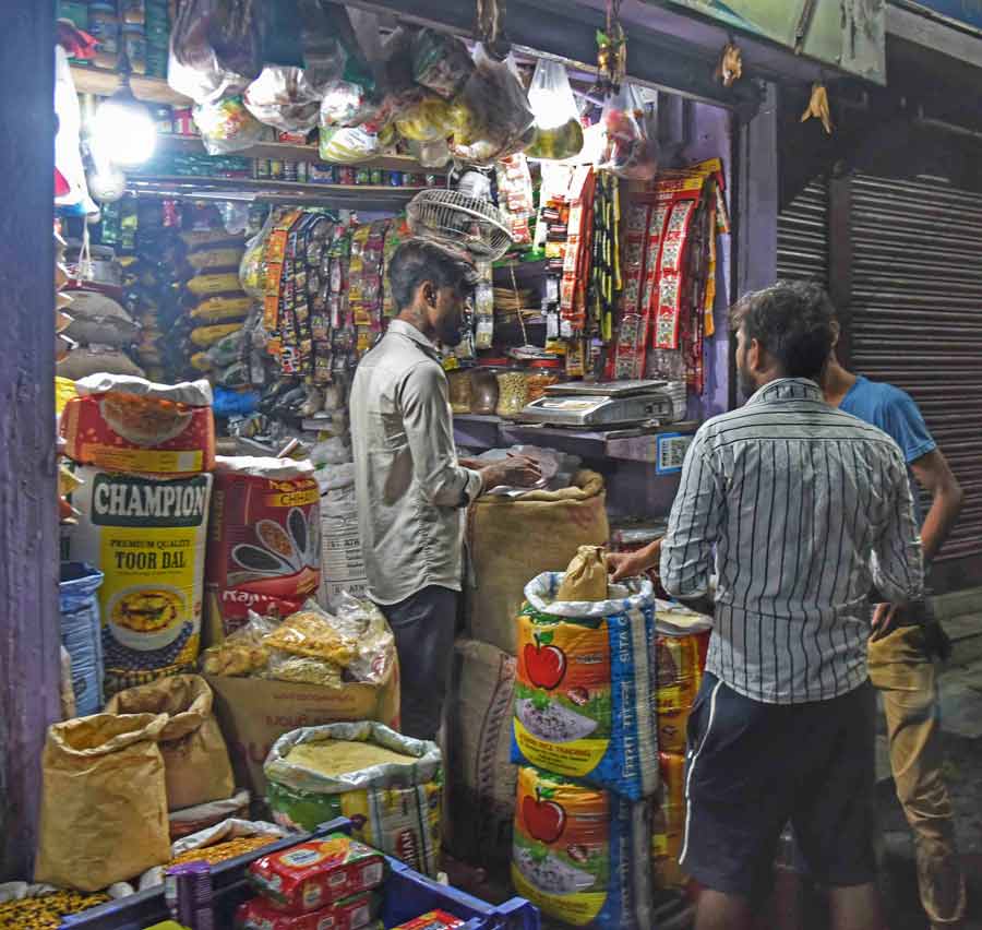 Grocery shops reopened and people headed out to buy essentials. In pictures, customers in a buying spree at a Taltala shop  