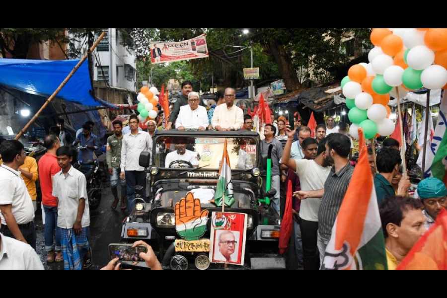 Congress candidate Pradip Bhattacharya with CPM veteran Biman Bose during a road show near Bowbazar
