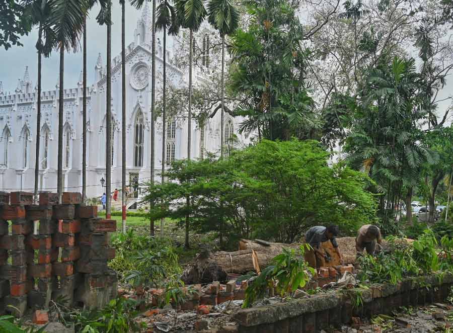 The wall adjoining St. Paul’s Cathedral was damaged during Cyclone Remal on Monday. On Thursday, workers were seen repairing it  