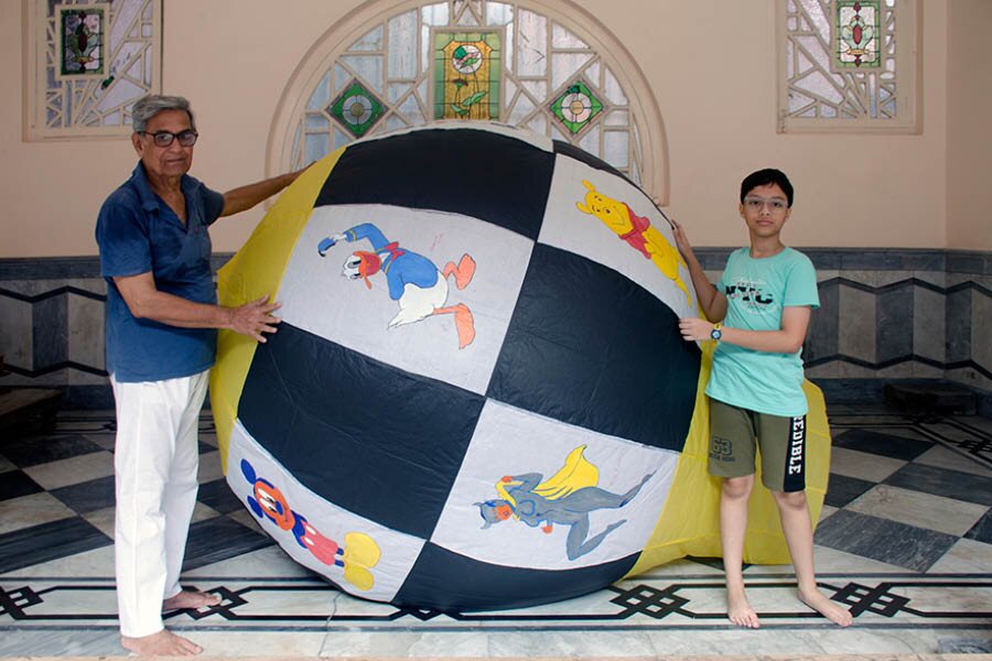 Ajoy Dutt (left) displays a ‘phanush’ with grandson Awharshi Dutt