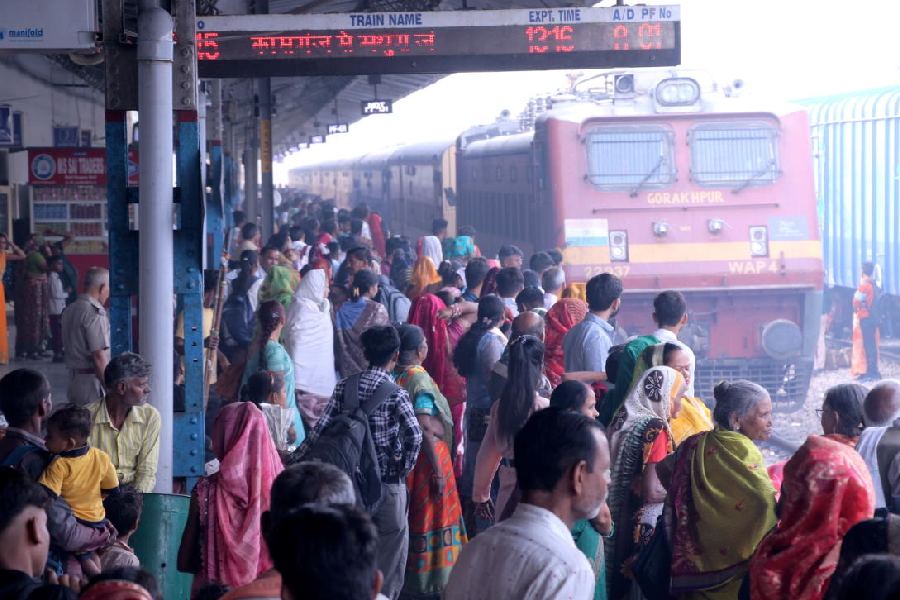Passengers wait to board a train on Bhai Dooj at Mathura Cantt Railway Station in Mathura. PTI