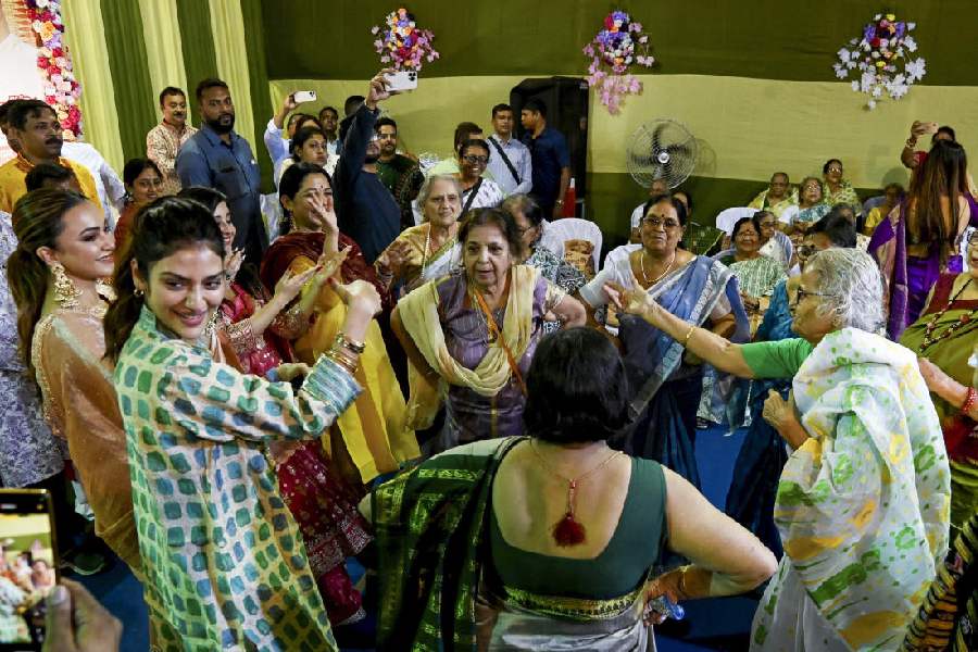 Former MP and Bengali film actor Nusrat Jahan visits an old age home, on 'Bhai Dooj' festival, in Kolkata. PTI