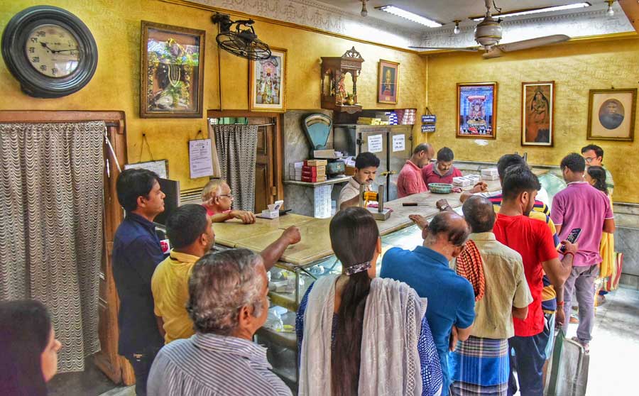 Sweets were high in demand for Bhai Phonta on Sunday. In picture, people queue up at the Bhim Chandra Nag shop in Bowbazar  
