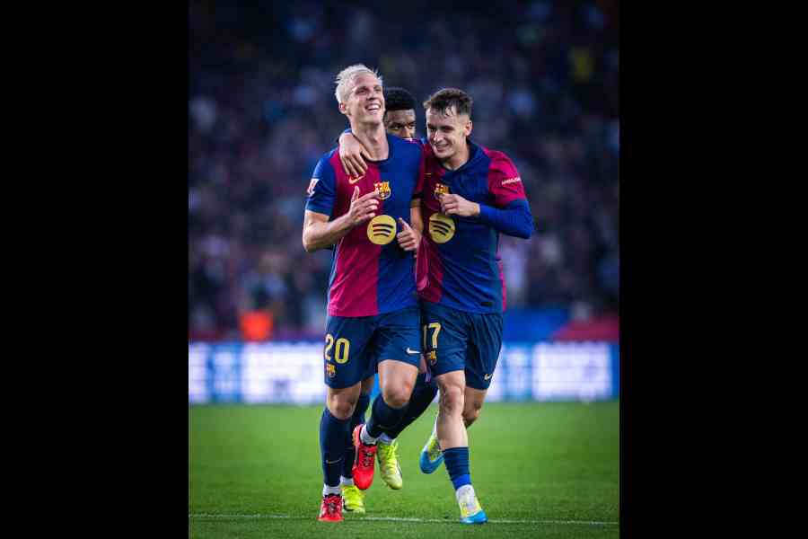 Barcelona players celebrate after victory over Espanyol.