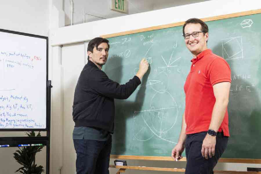 Vlad Tenev and Tudor Achim, Harmonic’s founders, pose at their company’s offices in Palo Alto, California