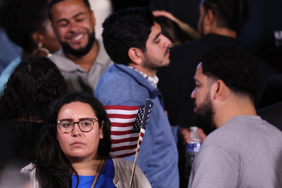An attendee holds a U.S. flag at the event held by U.S. Democratic presidential nominee Kamala Harris during Election Night, at Howard University, in Washington, U.S., November 5, 2024.