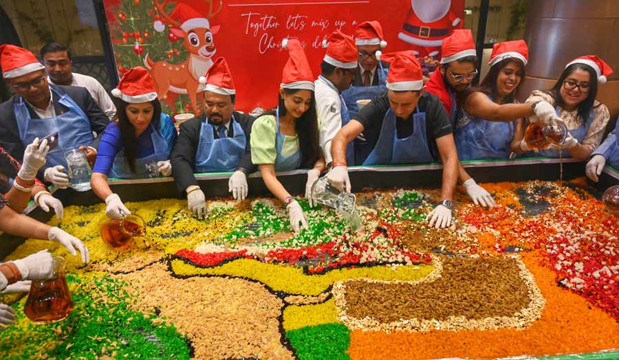 Guests take part in Holiday Inn Kolkata Airport’s First Christmas Cake Mixing Ceremony Of The Season on Wednesday