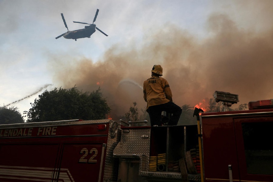 An on-duty firefighter tries to stop the fire in California, U.S. Reuters