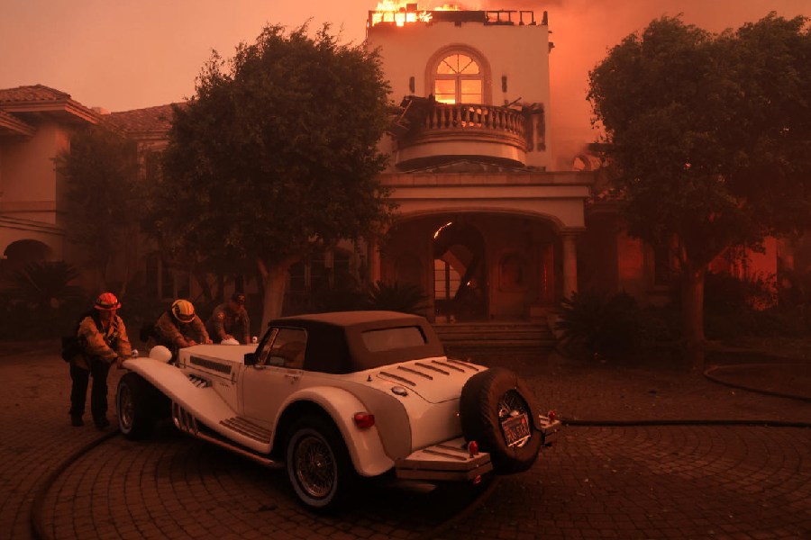 Rescue workers save a vintage car, in California, U.S. Reuters