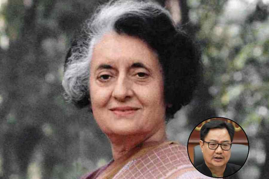 Congress member Rahul Gandhi shows a book of Constitution of India at the Parliament House complex on the first day of the first session of the 18th Lok Sabha, in New Delhi, Monday, June 24, 2024.
