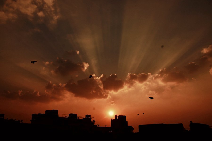 The sun bids adieu amid a partially cloudy sky on Saturday afternoon