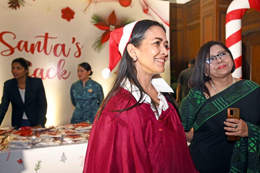 Esha Dutta, co-owner of Burnt Garlic, joined in the fun, sporting a Santa hat