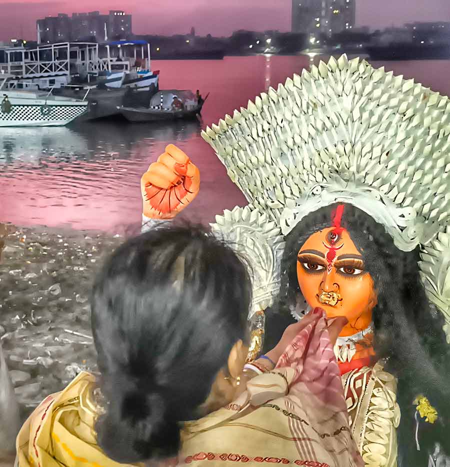 A Jagaddhatri idol during immersion at Babughat on Monday evening