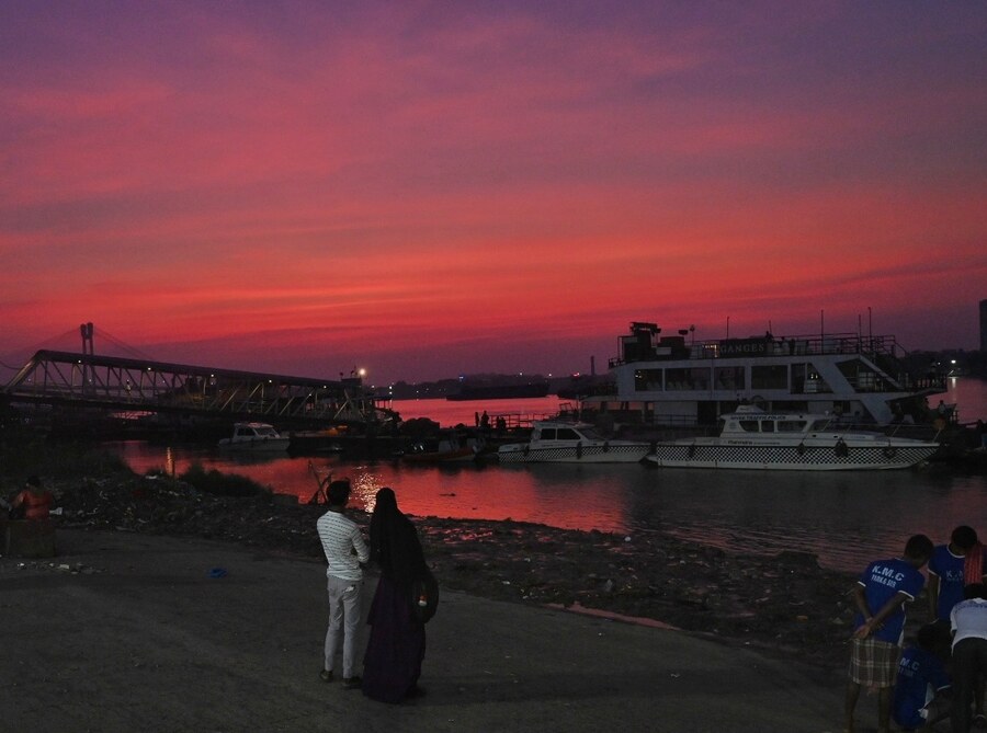 The sky at Babughat turns crimson at sunset on Tuesday