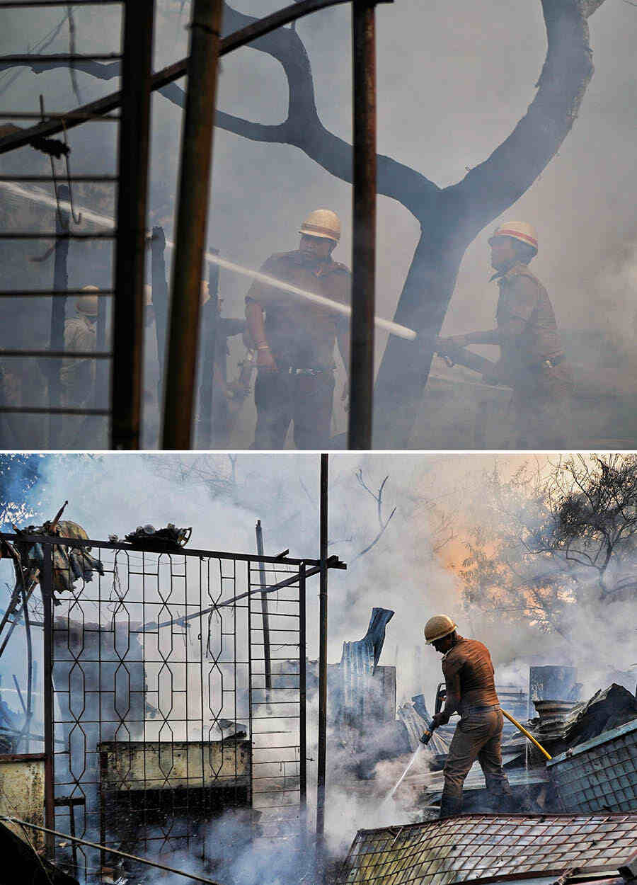 Fire-fighters battle a blaze at a market close to the Lord’s crossing on Wednesday afternoon. At least six fire tenders managed to douse the flames