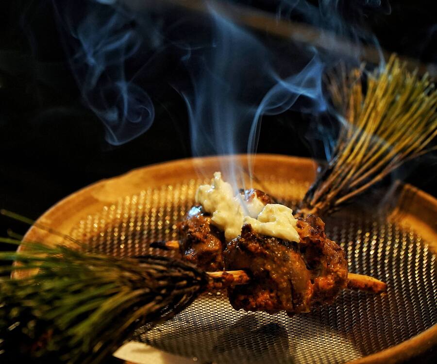 Makai Point, on the banks of the Dal Lake in Srinagar, is chef Prateek’s go-to spot during his short trips home. This popular spot, once known for its roasted corn stalls, eventually evolved into a destination for barbecued meat skewers, or ‘Tujj’. Naar’s take is Makki Tuji, which has charcoaled chicken offals, marinated with pickled chilli and mustard. The skewers are made from aromatic pine needle stems