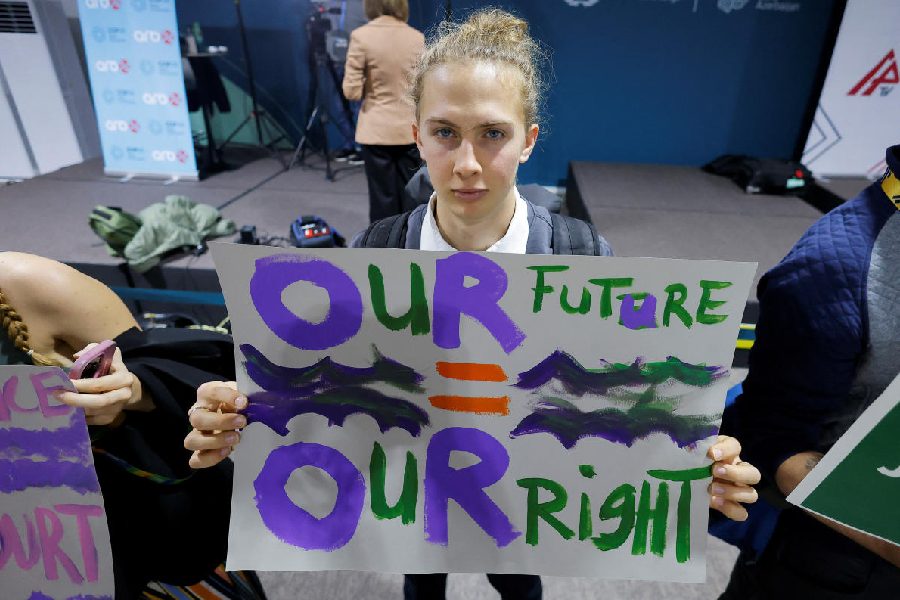 An environmental activist takes part in a protest to urge world leaders to commit to a strong climate finance deal during the United Nations Climate Change Conference (COP29), in Baku, Azerbaijan November 16, 2024.