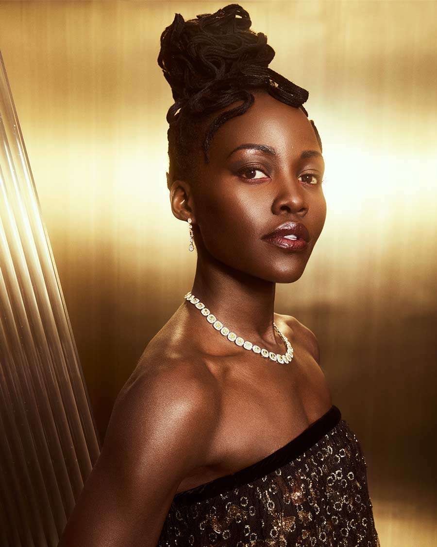 Lupita Nyong’o went for a black dress paired with a pearl necklace.