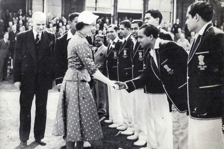 Probir Sen shakes hands with Queen Elizabeth II while on a tour of England in 1952