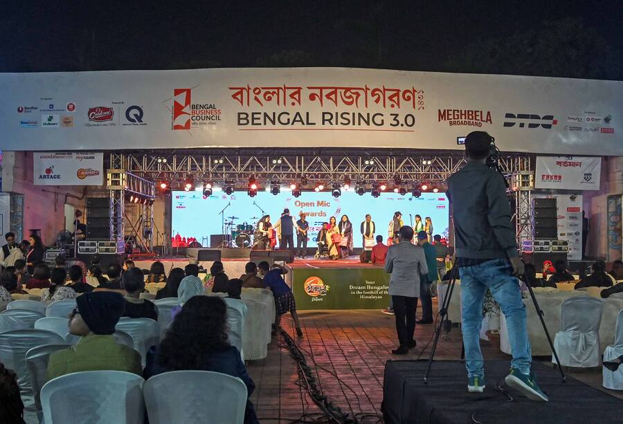 The audience enjoy open mic and a musical performance by Sayani Palit at Bengal Rising 3.0 