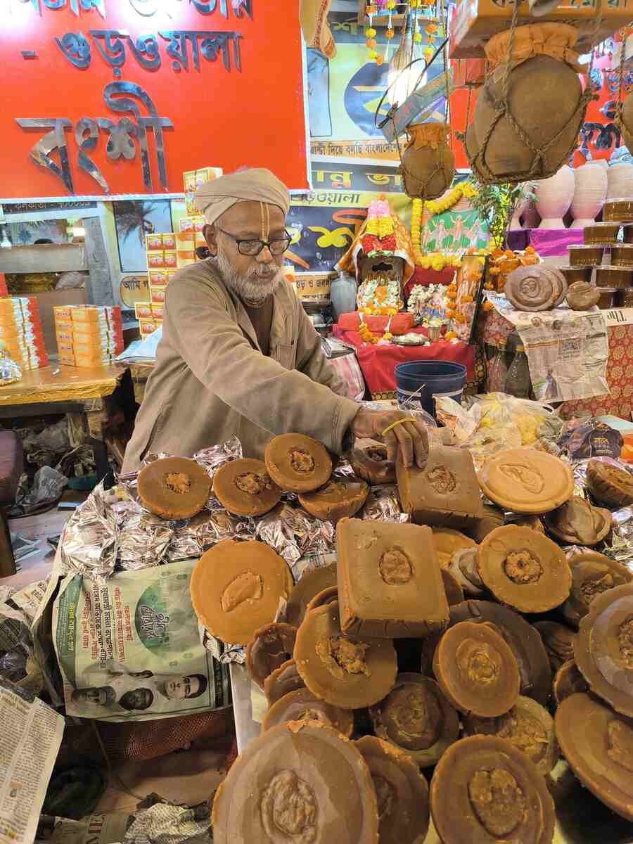 Bongshi, an elderly jaggery seller, hawks ‘nolen gur’ and ‘nolen patali’ from West Bengal and Bangladesh, at Baithakkhana Bazar in Sealdah