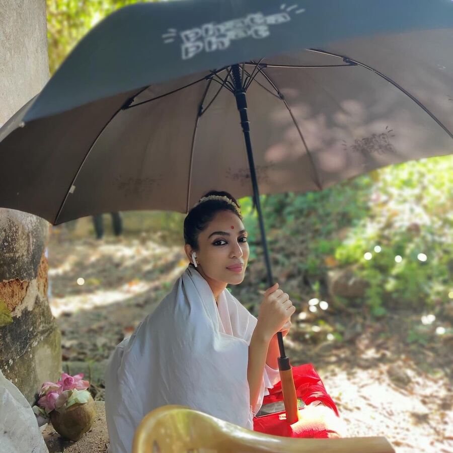 Sobhita looked radiant as she held an umbrella and gazed at the camera for a picture. A red bindi and gajra rounded off her look. 