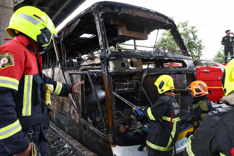 Rescue efforts after bus burns carrying teachers and students on outskirts of Bangkok.