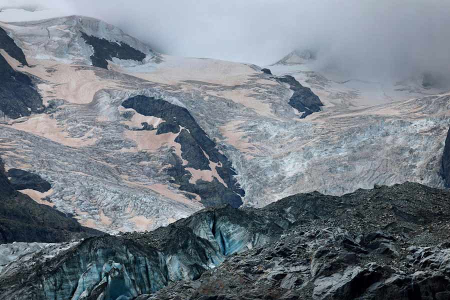 Crevasses and Sahara dust are seen on the Morteratsch Glacier amid climate change, in Pontresina, Switzerland, on September 3, 2024. 