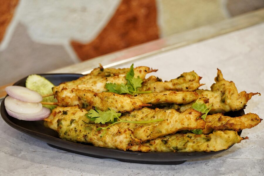 Murshidabadi Chicken Strips: These succulent strips offer a unique twist on traditional snack. The chicken is marinated in a blend of spices and lightly fried for a juicy bite with a hit of crispiness. These are also great as an appetiser or a snack with some cha or a homemade cocktail on Navami night