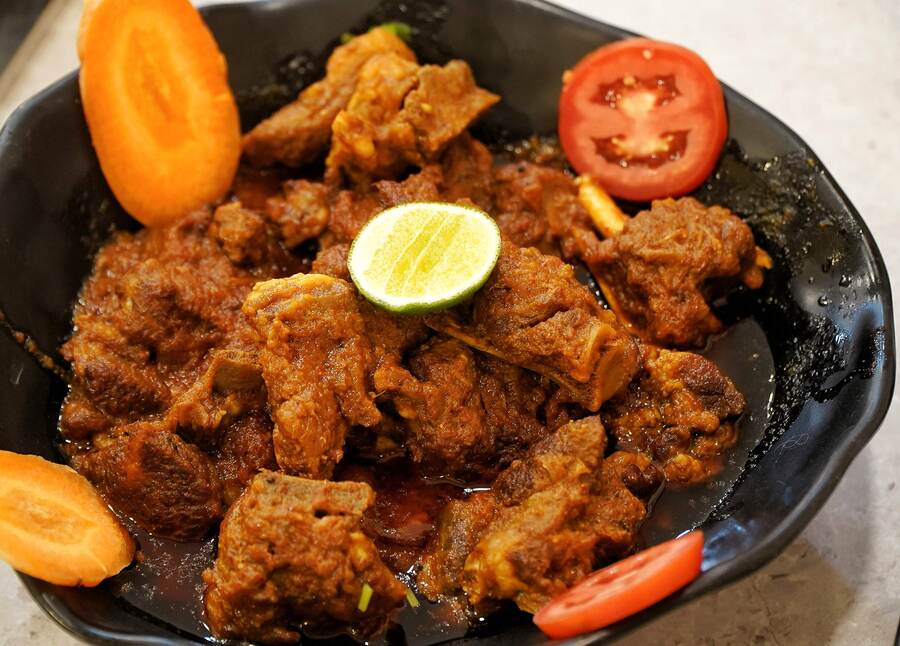 Mutton Kosha: No Puja menu is complete without a ‘kosha mangsho’ and this slow-cooked mutton Mutton Kosha is rich, spicy and flavourful with tender pieces of mutton, making it a perfect accompaniment to Basanti Pulao. Its melt-in-the-mouth texture is a delight for ‘kosha mangsho’ lovers