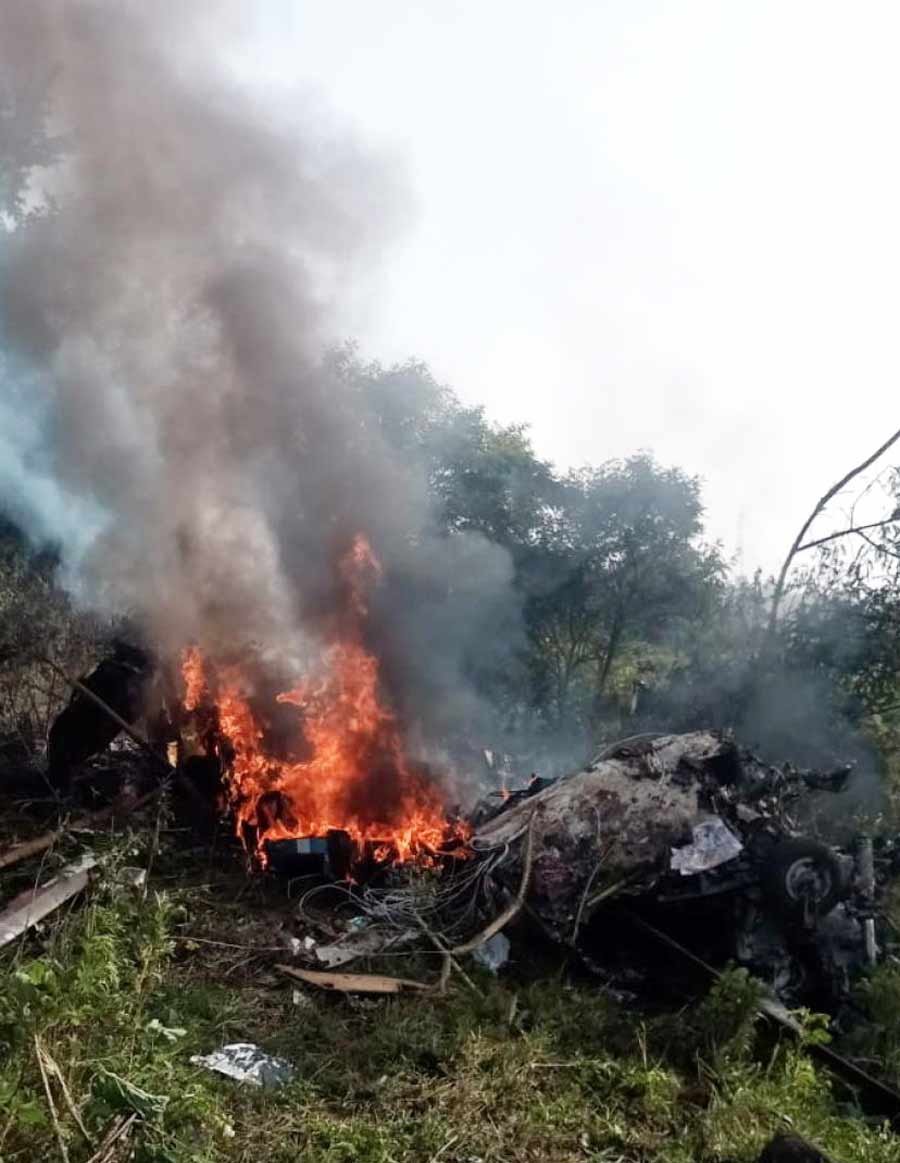 Wreckage of a helicopter after it crashed at Bavdhan area in Pune district.