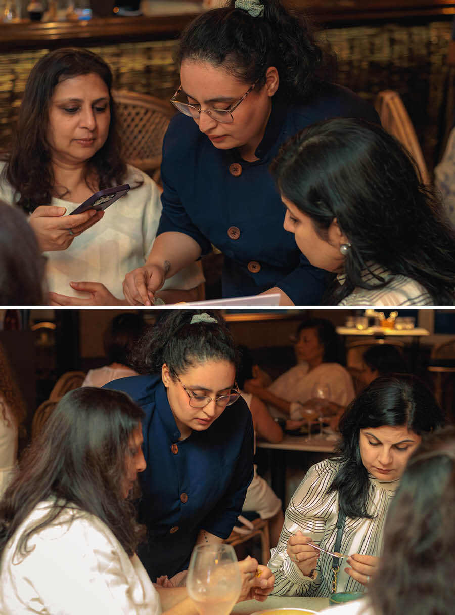 Committee members Nikita Kejriwal (left) and Rishika Samtam (right) learn the art of wrapping dim sums from Muskan Sethi. Speaking to My Kolkata on the sidelines of the event, Kejriwal said, ‘The committee of Kolkata International Women’s Club (KIWC) works very hard to find and curate unique immersive experiences for our members. From various workshops to cultural walks and talks, Durga puja pandal visits, author talks, charity fundraisers, and more, our members get the opportunity to learn more about the city we love and call home’