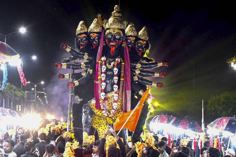 FACES OF FAITH: An idol of Goddess Kali is taken to a pandal on the eve of Navratri in Bhopal, Wednesday, October 2