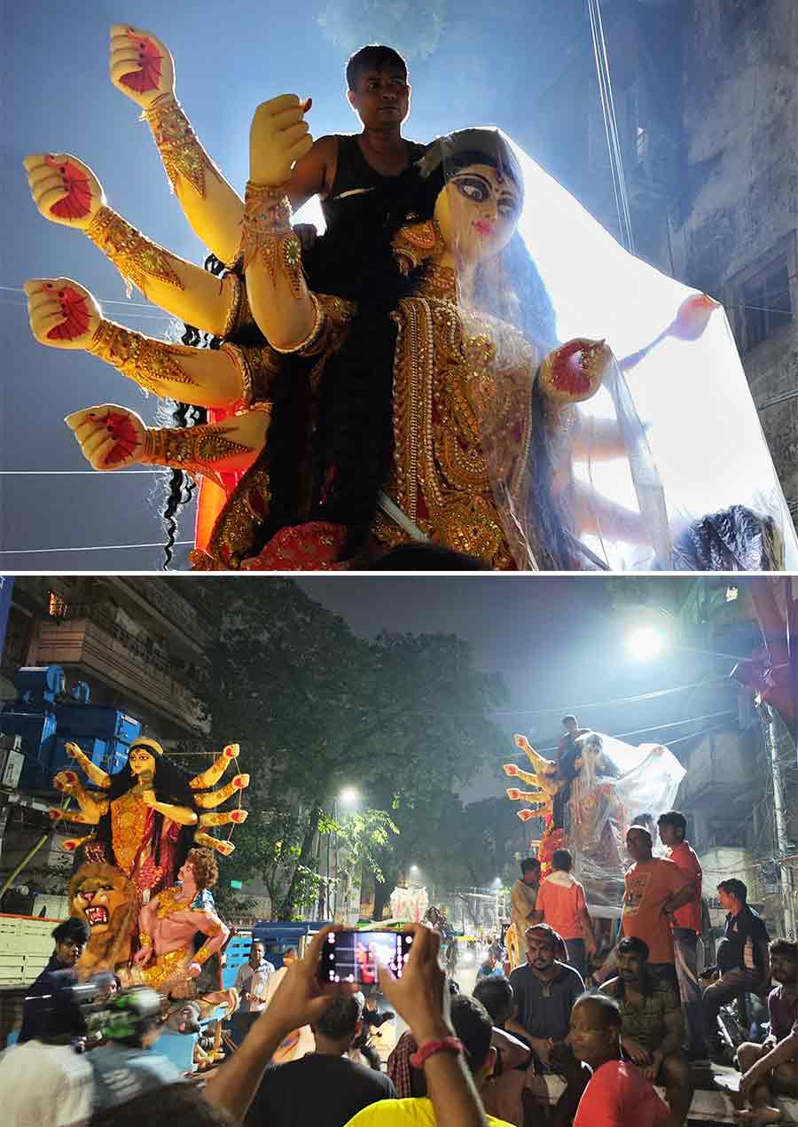 Kumartuli Patuapara in north Kolkata was buzzing with activity dead at night with workers loading idols of Durga and her children for being transported to puja pandals 
