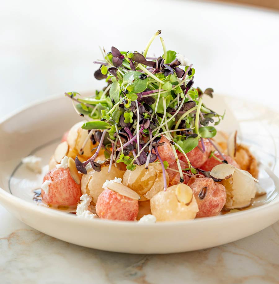 Melons, Peppermint Oil, Feta & Microgreens: The Melon Salad was a dish Auroni first made at Cafe Zoe, Mumbai, where his focus was perfecting technique — consistent knife work, identical plates. ‘Back then, it wasn’t my recipe, but it taught me precision. Now, I’ve made it my own. I’m not a fan of overly sweet dishes, so combining watermelon with honeydew and muskmelon creates a balance of flavours and textures,’ says Auroni. The saltiness of feta ties it all together, while radish microgreens add a punch that’s more exciting than typical rocket leaves. Drawing inspiration from Mediterranean and Japanese influences, it’s his contemporary take on a classic plate